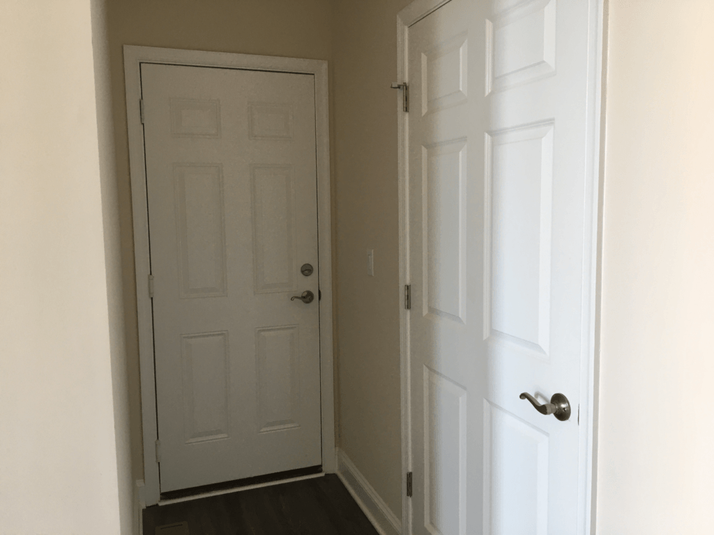 Are barn doors out of style? - Laundry room door and garage door too close to each other