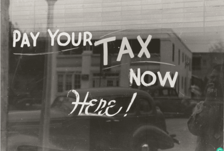 Why Do Homeowners Have to Pay Property Taxes? - Pay your tax now here sign