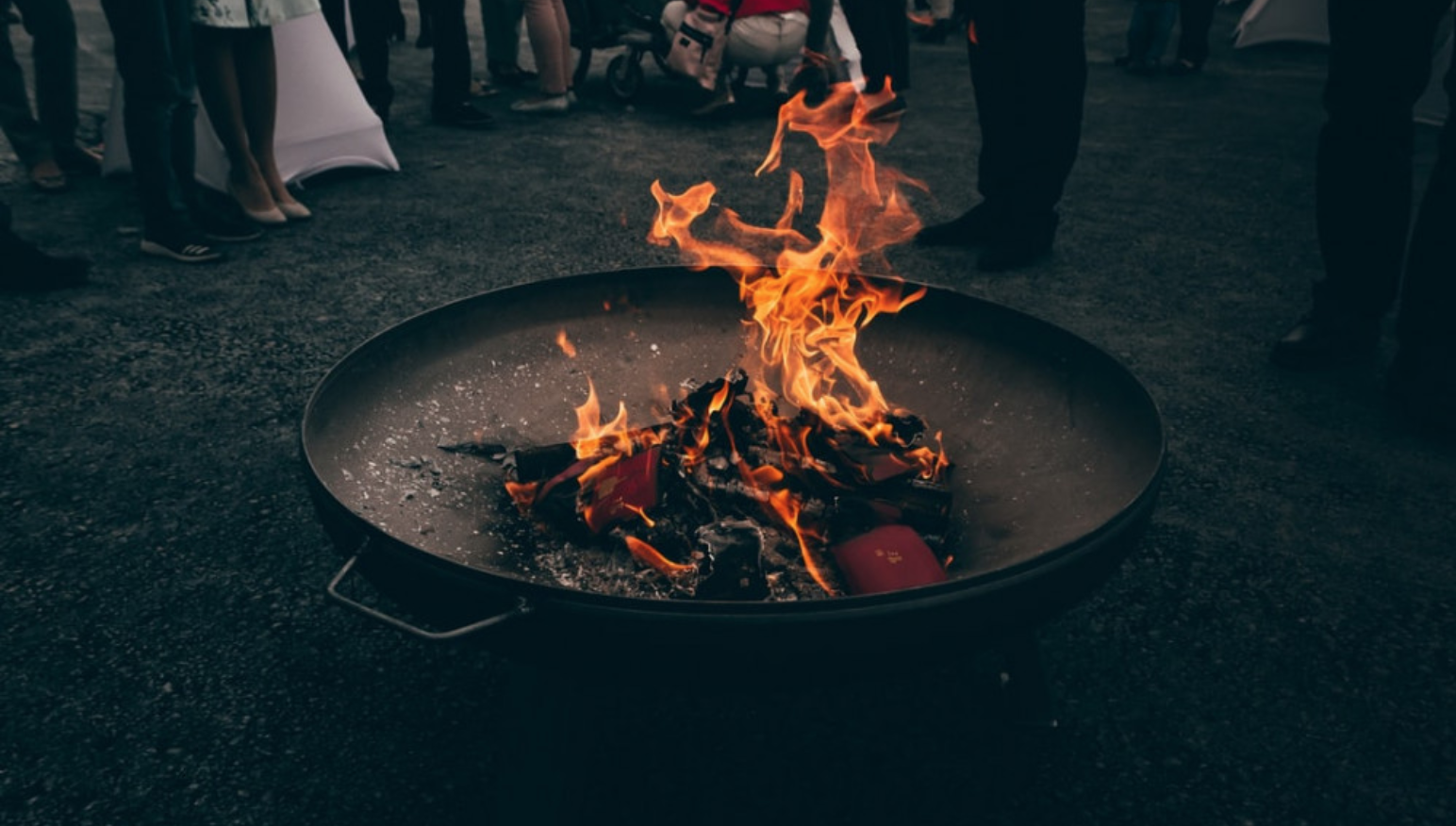 10 Things to Consider Before Building a Backyard Fire Pit - Fire Pit with People