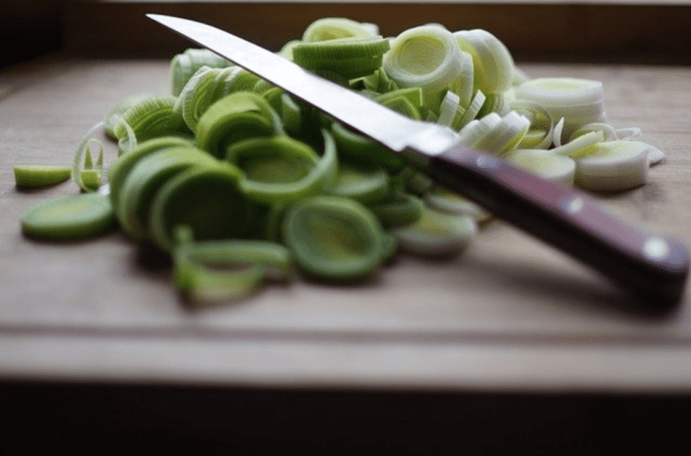 Are Plastic Cutting Boards Safe? - Cutting board with knife and veggies